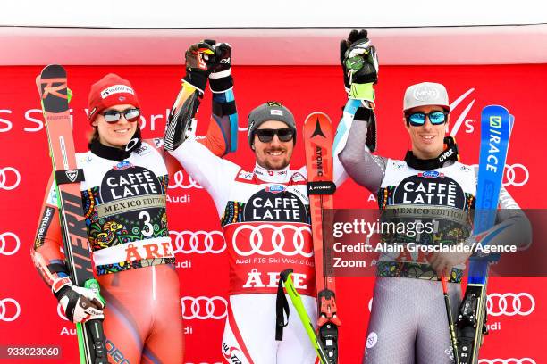 Henrik Kristoffersen of Norway takes 2nd place, Marcel Hirscher of Austria takes 1st place, Victor Muffat-jeandet of France takes 3rd place during...