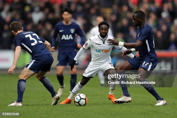 Nathan Dyer of Swansea City is challenged by Moussa Sissoko of Tottenham Hotspur during The Emirates FA Cup Quarter Final match between Swansea City...