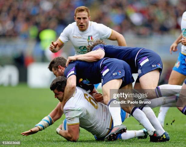 Sebastian Negri of Italy is tackled by Greig Laidlaw of Scotland during the NatWest Six Nations match between Italy and Scotland at Stadio Olimpico...