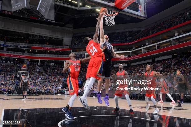 Kosta Koufos of the Sacramento Kings shoots against DeAndre Liggins of the New Orleans Pelicans on March 7, 2018 at Golden 1 Center in Sacramento,...
