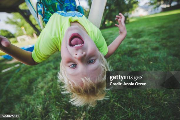 boy hanging upside down - 5 funny foto e immagini stock