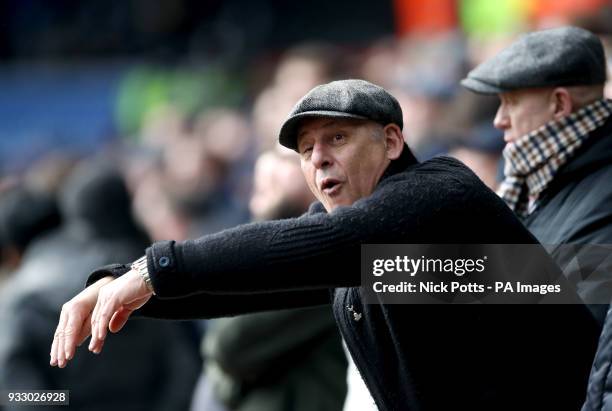 Tottenham Hotspur fan mimics Swansea City fans as they shout "Cheat" and "Diver" whilst Tottenham Hotspur's Dele Alli comes on as substitute during...