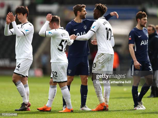 Fernando Llorente of Tottenham Hotspur and Tammy Abraham of Swansea City embrace after the Emirates FA Cup Quarter Final match between Swansea City...