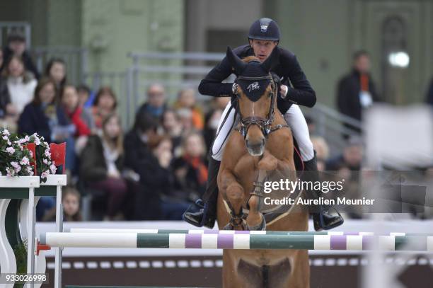 Kevin Staut of France on Ayade de Septon et HDC competes during the Saut Hermes at Le Grand Palais on March 17, 2018 in Paris, France.