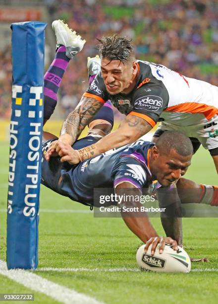 Suliasi Vunivalu of the Melbourne Storm dives to score a try during the round two NRL match between the Melbourne Storm and the Wests Tigers at AAMI...