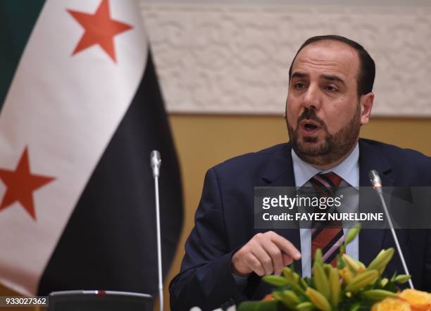 Chief negotiator of the Syrian Negotiation Commission Nasr al-Hariri speaks during a press conference in the Saudi capital, Riyadh on March 17, 2018....