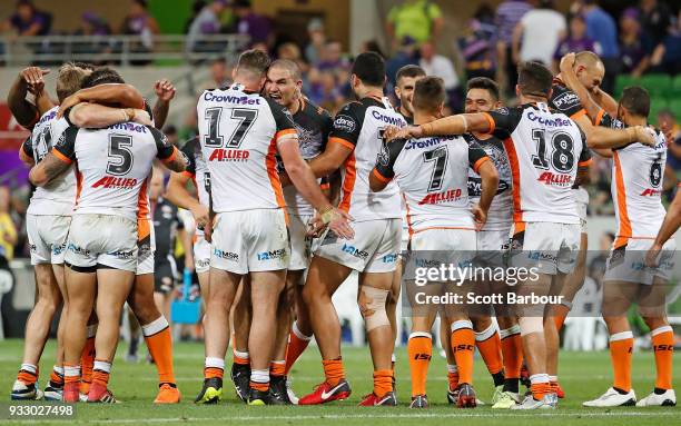 The Tigers celebrate winning the round two NRL match between the Melbourne Storm and the Wests Tigers at AAMI Park on March 17, 2018 in Melbourne,...