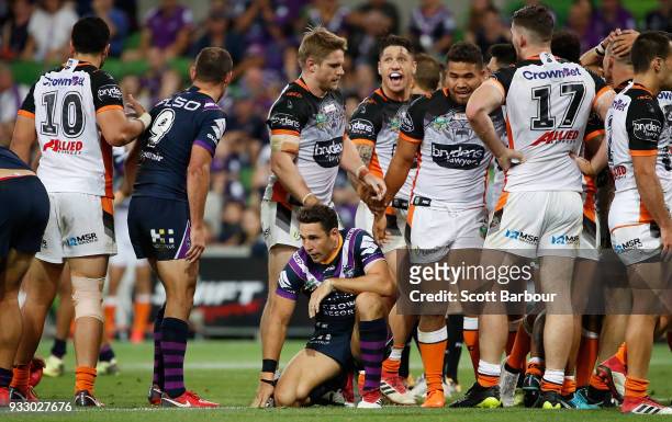 Billy Slater of the Melbourne Storm looks dejected as the Tigers celebrates winning the round two NRL match between the Melbourne Storm and the Wests...
