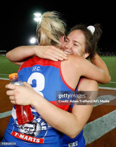 Emma Kearney of the Bulldogs celebrates with Katie Brennan of the Bulldogs after making it through to the grand final during the 2018 AFLW Round 07...