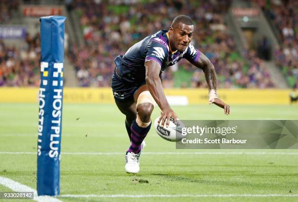 Suliasi Vunivalu of the Melbourne Storm dives to score a try during the round two NRL match between the Melbourne Storm and the Wests Tigers at AAMI...