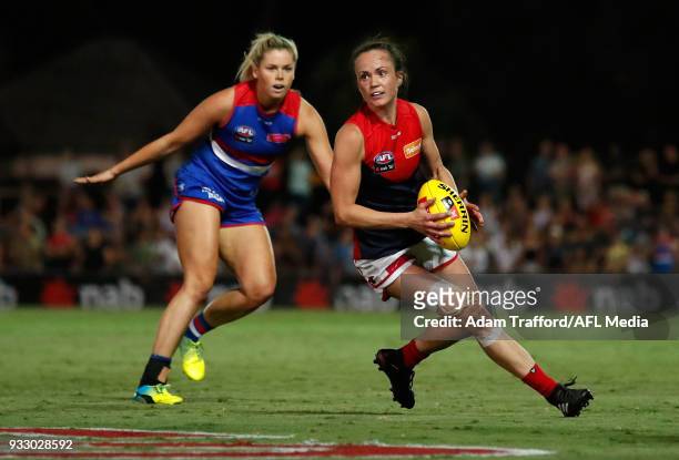 Daisy Pearce of the Demons in action ahead of Katie Brennan of the Bulldogs during the 2018 AFLW Round 07 match between the Western Bulldogs and the...