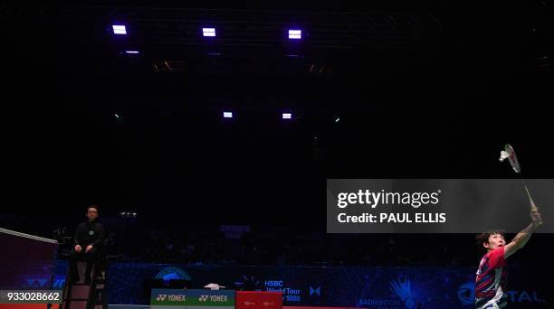 South Korea's Son Wan Ho returns against China's Shi Yuqi during their men's singles semi-final match All England Open Badminton Championships in...