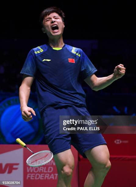 China's Shi Yuqi celebrates beating South Korea's Son Wan Ho during their men's singles semi-final match All England Open Badminton Championships in...