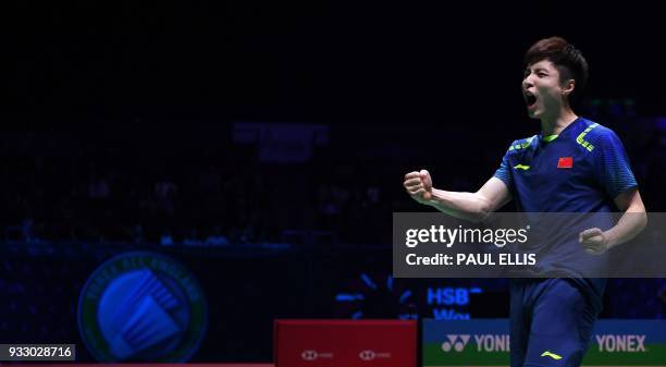 China's Shi Yuqi celebrates beating South Korea's Son Wan Ho during their men's singles semi-final match All England Open Badminton Championships in...