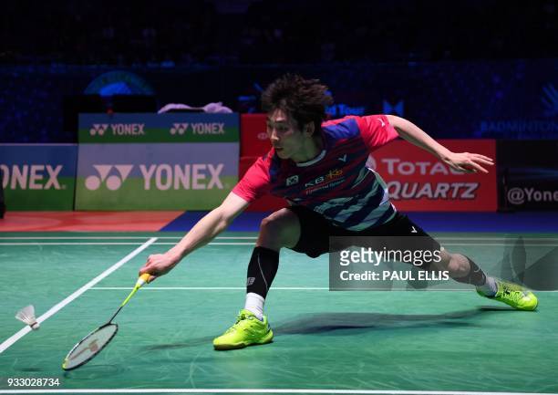 South Korea's Son Wan Ho returns against China's Shi Yuqi during their men's singles semi-final match All England Open Badminton Championships in...