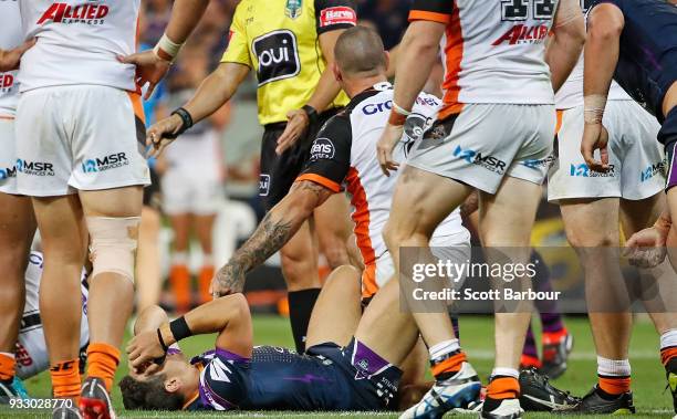 Billy Slater of the Melbourne Storm looks dejected as the Tigers celebrates winning the round two NRL match between the Melbourne Storm and the Wests...