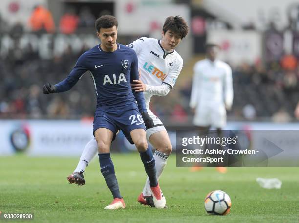 Tottenham Hotspur's Dele Alli battles with Swansea City's Ki Sung-Yueng during the Emirates FA Cup Quarter-Final between Swansea City and Tottenham...