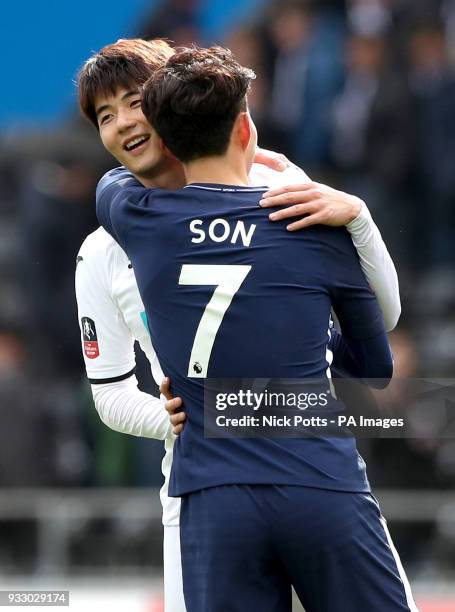 Tottenham Hotspur's Son Heung-Min and Swansea City's Ki Sung-yueng hug each other at the end of the Emirates FA Cup, quarter final match at the...