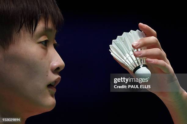 China's Chen Yufei prepares to serve against Taiwan's Tai Tzu Ying during their women's singles semi-final match at the All England Open Badminton...