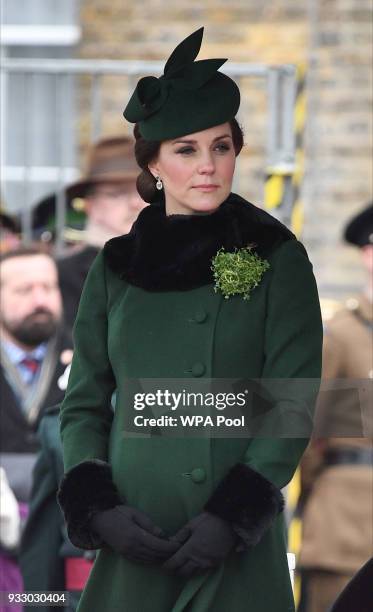 Catherine, Duchess of Cambridge attends and presents the 1st Battalion Irish Guardsmen with shamrocks during the annual Irish Guards St Patrick's Day...