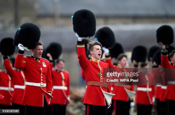Irish Guards stand on parade as Catherine, Duchess of Cambridge and Prince William, Duke Of Cambridge attend the annual Irish Guards St Patrick's Day...