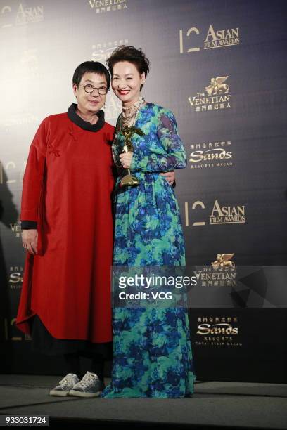 Director Ann Hui and actress Kara Wai Ying Hung pose backstage during the 12th Asian Film Awards at the Venetian Hotel on March 17, 2018 in Macao,...