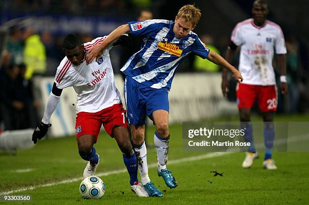Eljero Elia of Hamburg and Dennis Grote of Bochum battle for the ball during the Bundesliga match between Hamburger SV and VfL Bochum at the HSH...