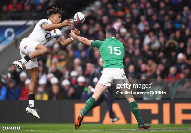 Anthony Watson of England fumbles the ball while under presser from Rob Kearney of Ireland , which later leads to Ireland scoring a try during the...