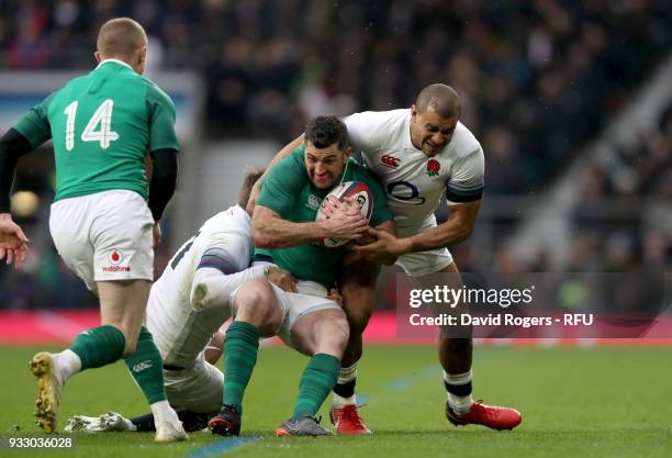 Rob Kearney of Ireland is tackled by Jonathan Joseph of England and Elliot Daly of England during the NatWest Six Nations match between England and...