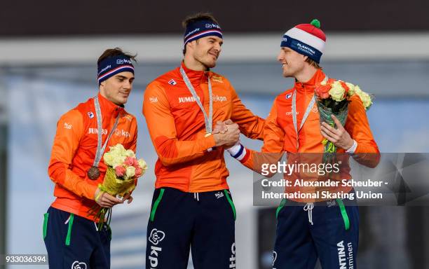 Jan Smeekens of the Netherlands, Hein Otterspeer of the Netherlands and Ronald Mulder of the Netherlands stand on the podium after the Men's 500m...
