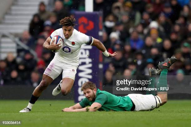 Anthony Watson of England gets past Iain Henderson of Ireland during the NatWest Six Nations match between England and Ireland at Twickenham Stadium...