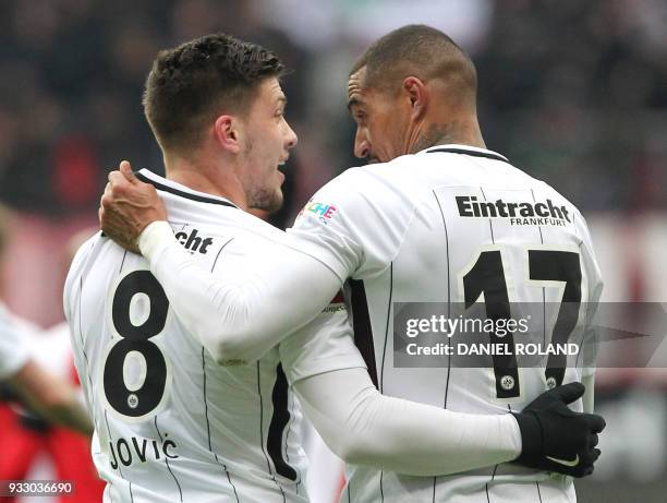 Frankfurt's Serbian forward Luka Jovic celebrates scoring the 2-0 with Frankfurt's Ghanaian midfielder Kevin-Prince Boateng during the German First...