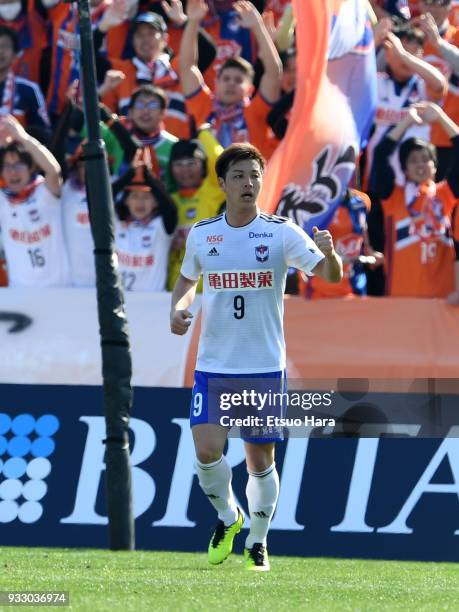 Atsushi Kawata of Albirex Niigata celebrates scoring his side's first goal during the J.League J2 match between Yokohama FC and Albirex Niigata at...