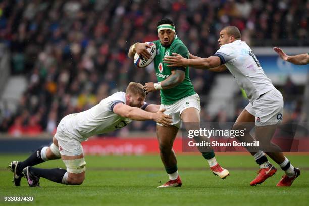 Bundee Aki of Ireland is tackled by Jonathan Joseph of England during the NatWest Six Nations match between England and Ireland at Twickenham Stadium...