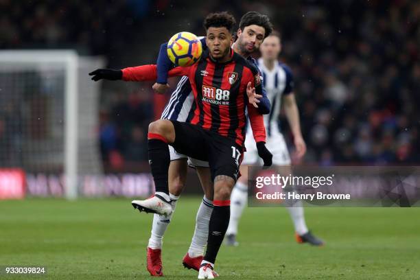 Joshua King of AFC Bournemouth and Claudio Yacob of West Bromwich Albion battle for the ball during the Premier League match between AFC Bournemouth...