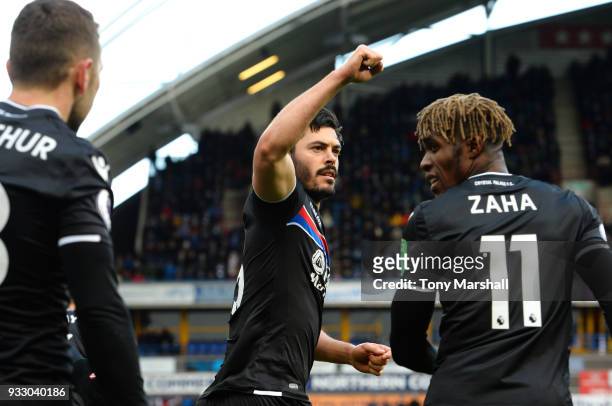 James Tomkins of Crystal Palace celebrates scoring his side's first goal with Wilfried Zaha during the Premier League match between Huddersfield Town...