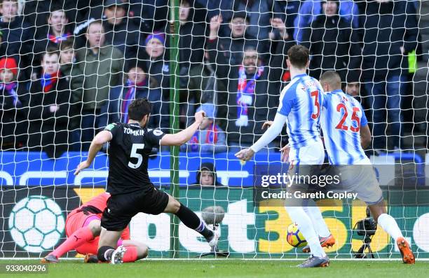 James Tomkins of Crystal Palace scores his side's first goal during the Premier League match between Huddersfield Town and Crystal Palace at John...