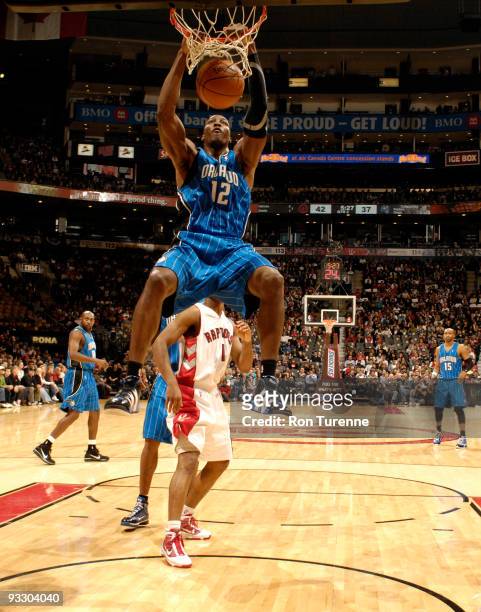Dwight Howard of the Orlando Magic throws down the two-handed slam against the Toronto Raptors on November 22, 2009 at the Air Canada Centre in...