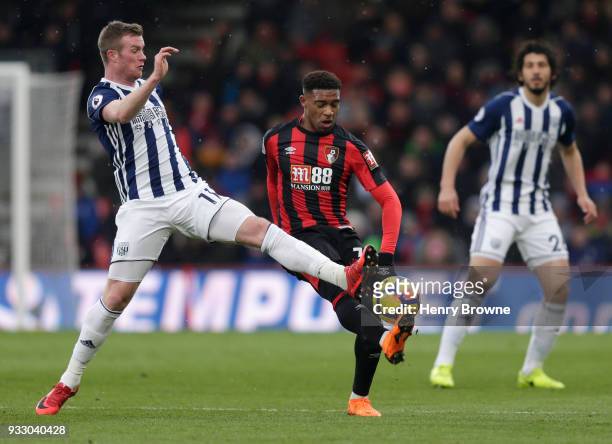 Jordon Ibe of AFC Bournemouth is challenged by Chris Brunt of West Bromwich Albion during the Premier League match between AFC Bournemouth and West...