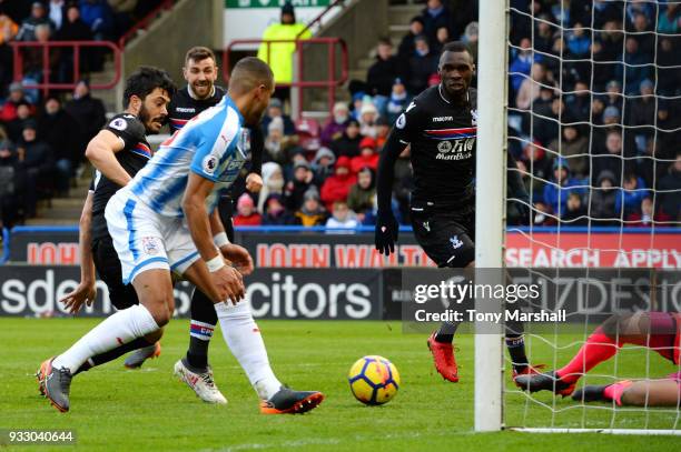 James Tomkins of Crystal Palace scores his side's first goal during the Premier League match between Huddersfield Town and Crystal Palace at John...