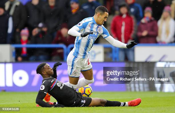 Crystal Palace's Jeffrey Schlupp ad Huddersfield Town's Tom Ince battle for the ball during the Premier League match at the John Smith's Stadium,...