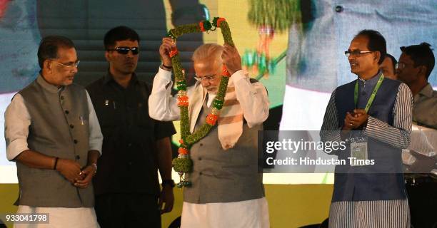 Radha Mohan Singh welcomes Prime Minister Narendra Modi and Madhya Pradesh Chief Minister Shivraj Singh Chouhan during the Krishi Unnati Mela 2018,...