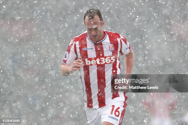 Charlie Adam of Stoke City leaves the pitch following being shown a red card during the Premier League match between Stoke City and Everton at Bet365...