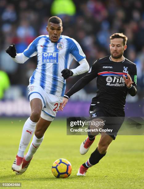 Collin Quaner of Huddersfield Town and Yohan Cabaye of Crystal Palace battle for the ball during the Premier League match between Huddersfield Town...