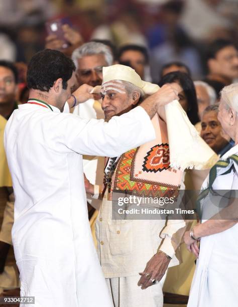 Congress President Rahul Gandhi felicitates senior citizens and congress party workers during the 84th Plenary Session of Indian National Congress at...