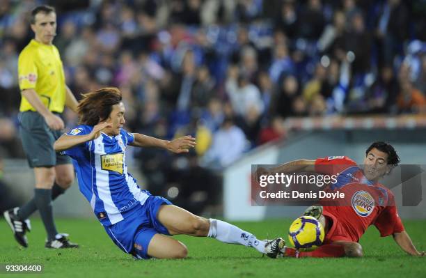 Shunsuke Nakamura of Espanyol tackles Pedro Rios of Getafe during the La Liga match between Espanyol and Getafe at Cornella-El Prat stadium on...