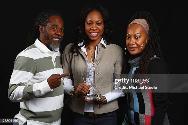 400m World Champion and 4×400m Olympic Champion Sanya Richards of USA poses with her trophie and her mother Sharon Richards and father Archie...
