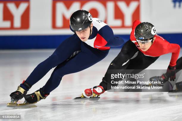 Dmitry Migunov of France competes against Lucas Ng of Singapore in the men's 1500 meter ranking finals during the World Short Track Speed Skating...