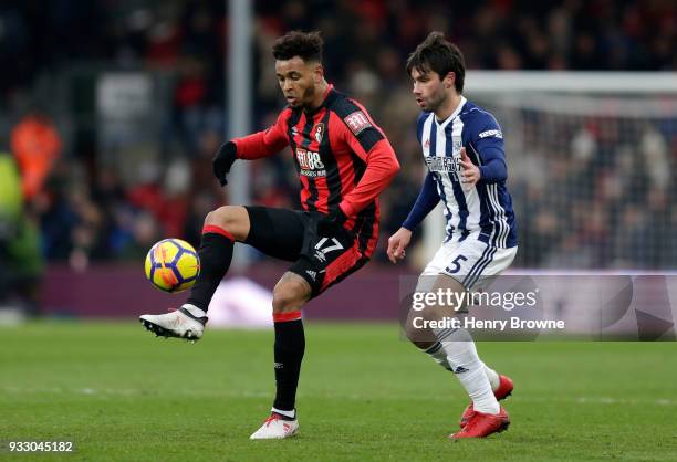 Joshua King of AFC Bournemouth and Claudio Yacob of West Bromwich Albion battle for the ball during the Premier League match between AFC Bournemouth...