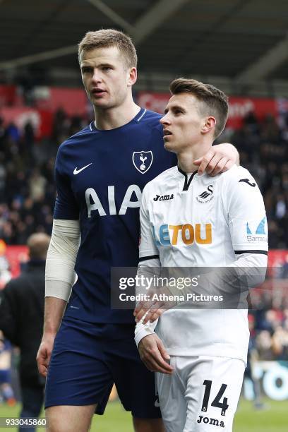 Eric Dier of Tottenham Hotspur consoles Tom Carroll of Swansea after the final whistle of the Fly Emirates FA Cup Quarter Final match between Swansea...